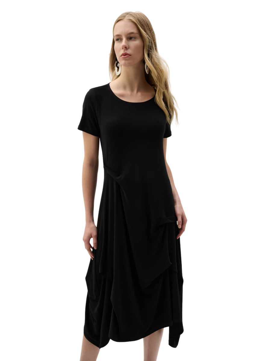 Black short sleeve midi dress with draped layered skirt and round neckline on a model against white background
