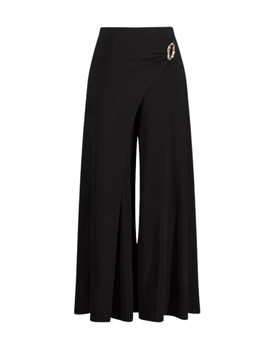 Black wide-leg pants with an asymmetrical wrap detail and decorative buckle at the waist