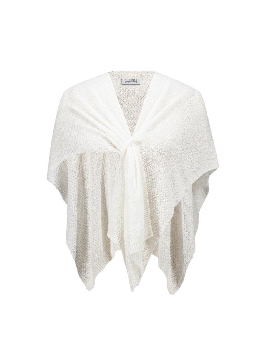 Cream-colored knitted shawl or wrap displayed against a white background