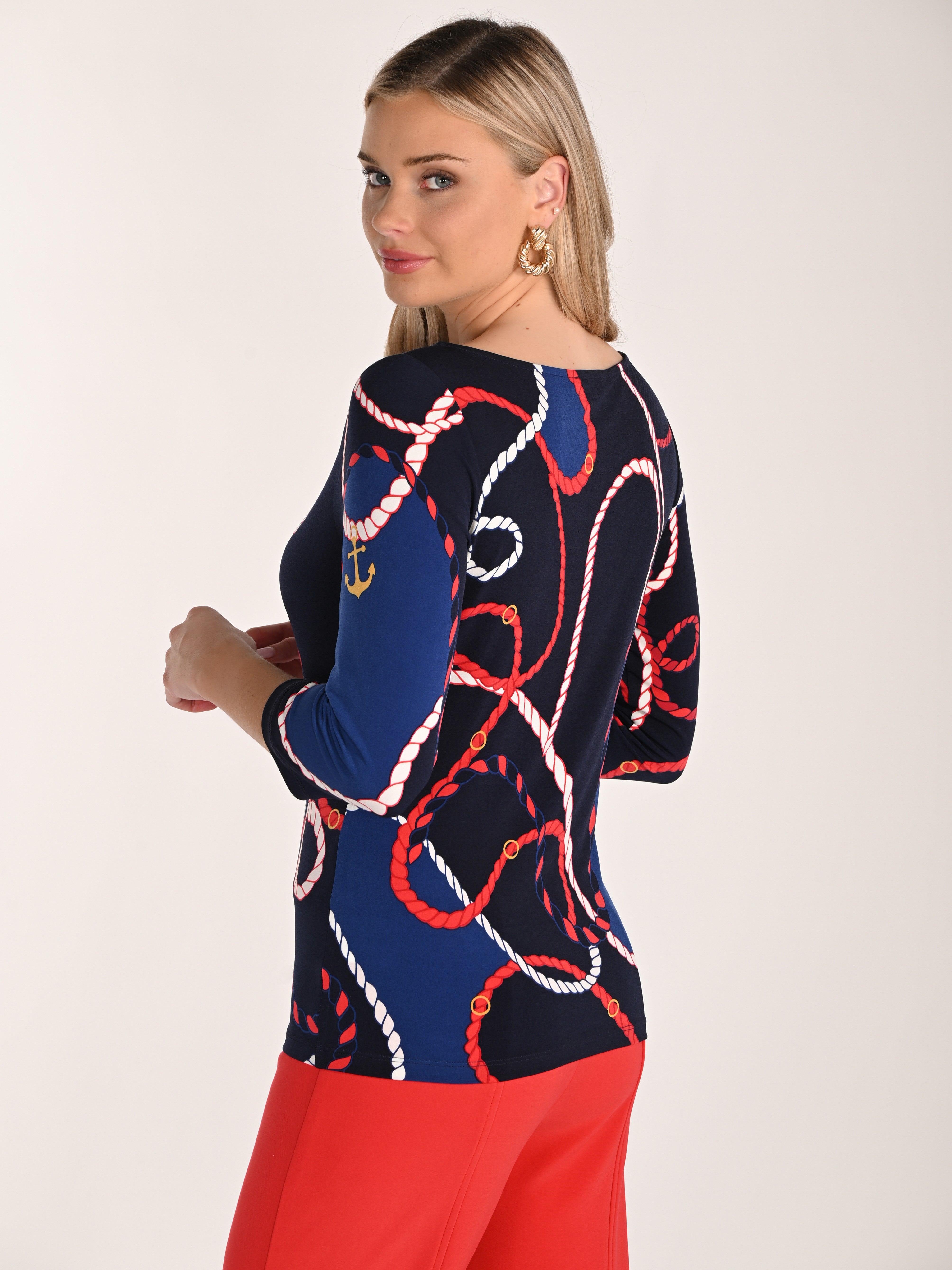 Frank Lyman Design Sailor Style 2/4 Sleeve Top in navy blue with red and white rope print, styled with red pants