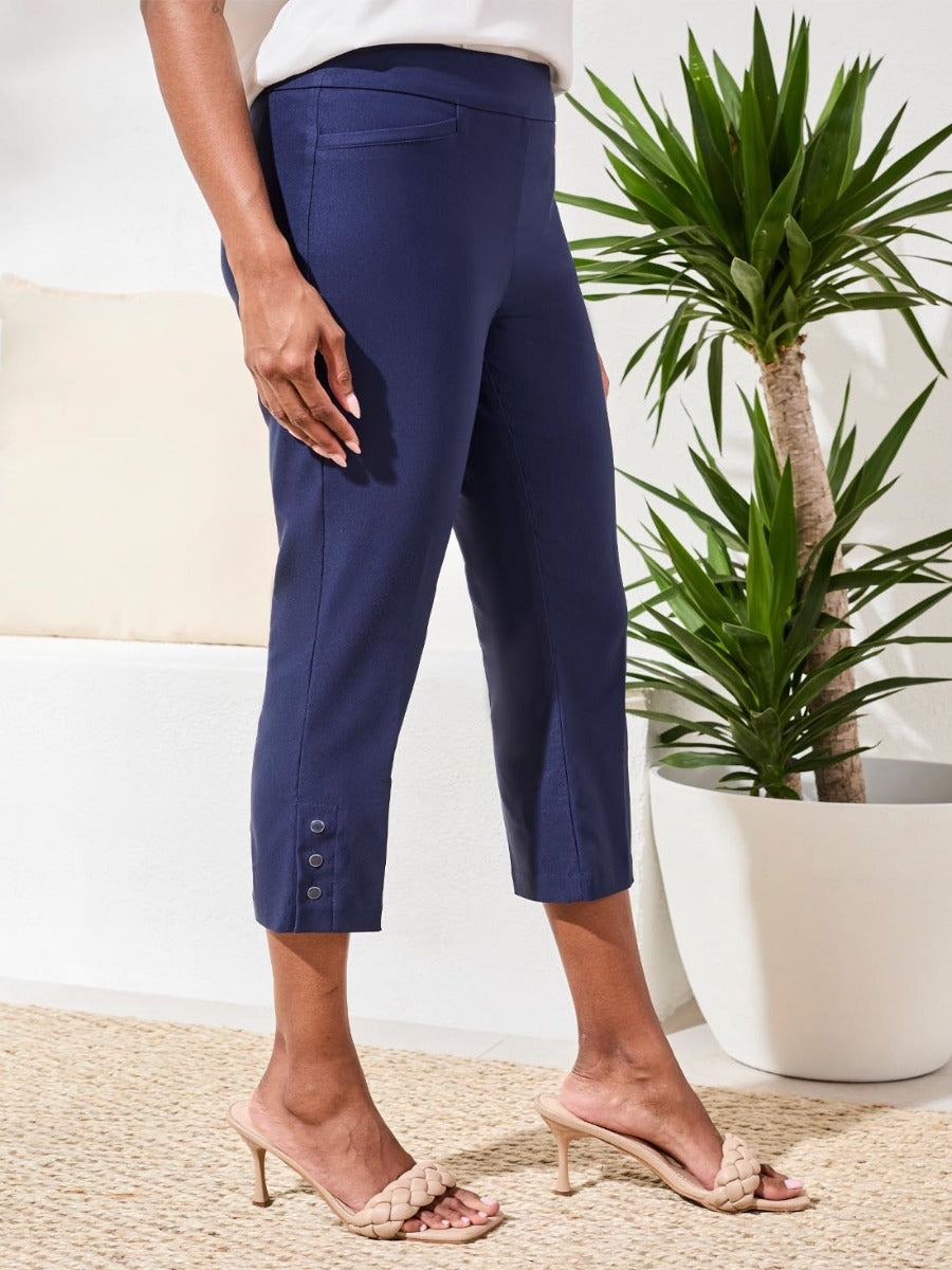 Tribal Flatten It Snap 22" Capri Pants in navy by Tribal Sportswear Inc. with button details near the hem