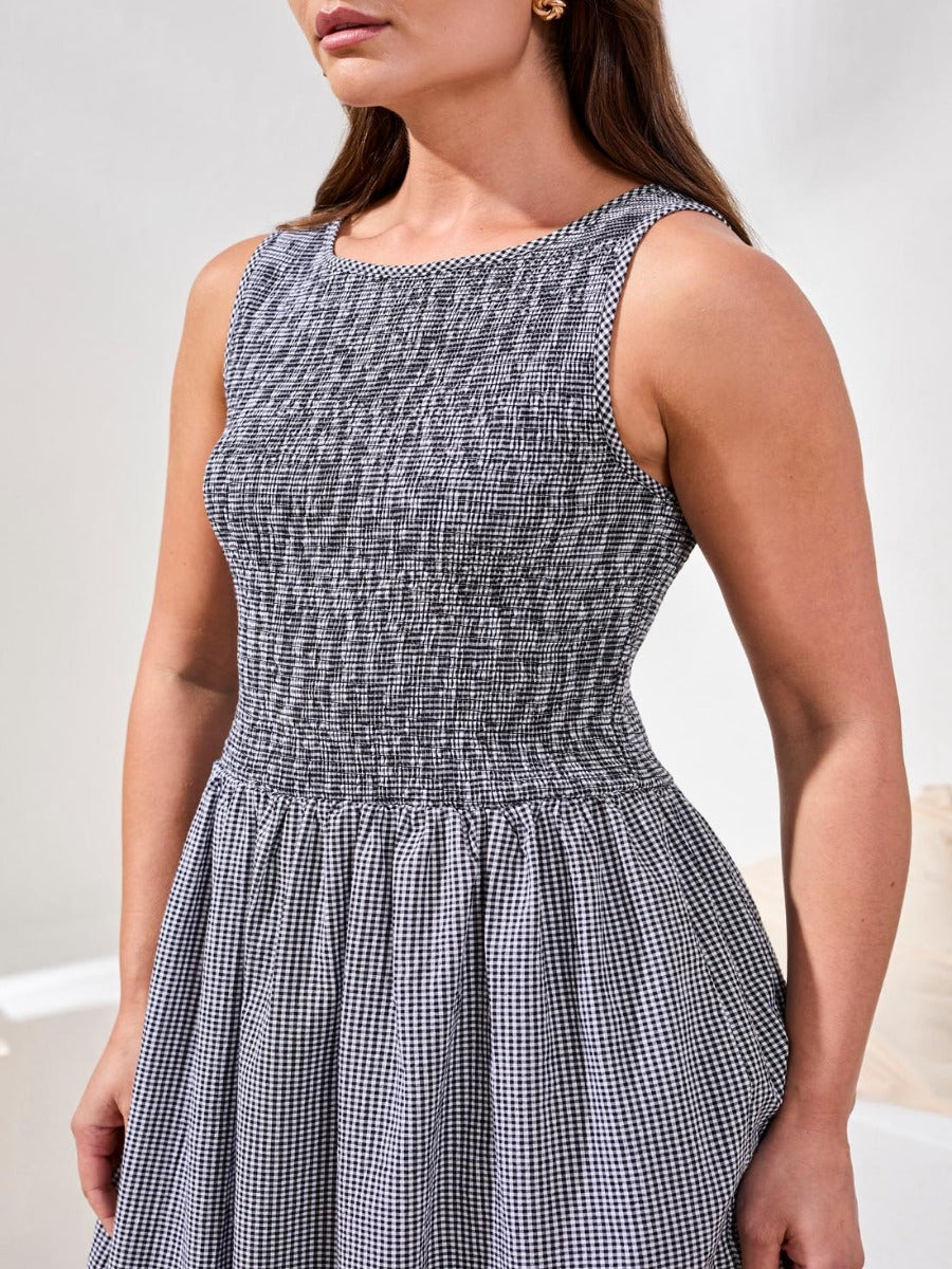 Close-up of sleeveless black and white gingham Tribal Prep N Petals Gingham Midi Dress by Tribal Sportswear Inc.