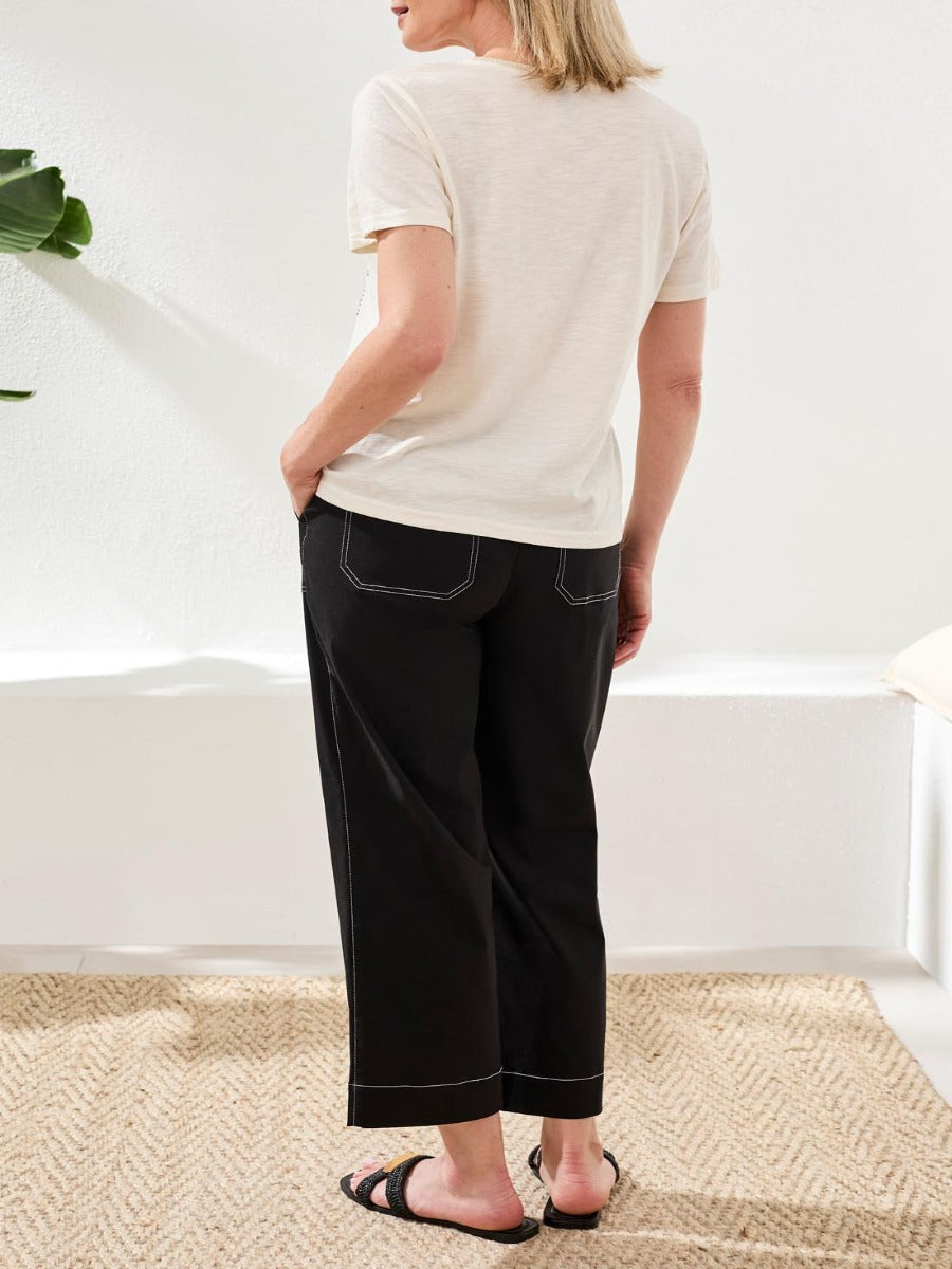 Tribal Fleur Desert Embroidered Palm Tee by Tribal Sportswear Inc. displayed in beige fabric from back view