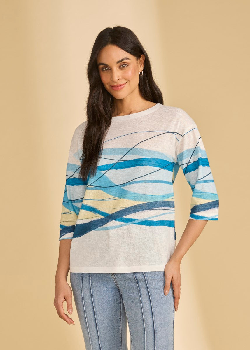 FDJ Ocean Breeze ¾ Sleeve Top by French Dressing in soft fabric with blue and yellow wave patterns, paired with denim jeans.