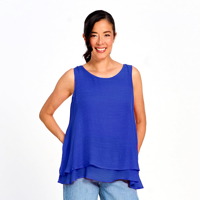 Sharon Layered Sleeveless Blouse in cobalt blue by Red Coral, styled as a lightweight sleeveless top with layered hem.