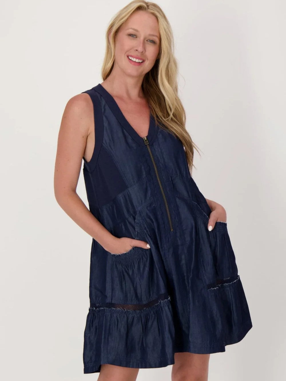 Spanner Gabby Tiered Mesh Insert Sleeveless Dress in navy denim with front zipper and pockets by Spanner