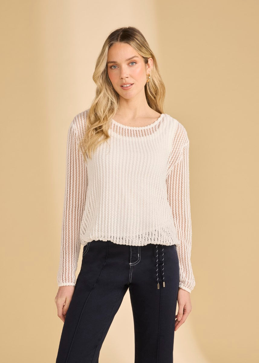 Lightweight FDJ Mesh Knit Bubble Top by French Dressing in soft white paired with dark pants for a chic look.
