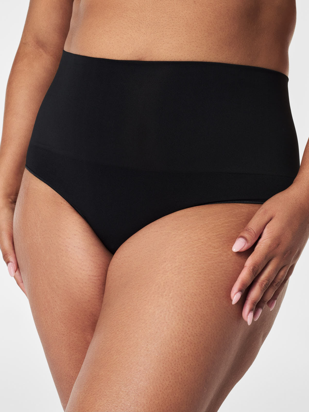 Spanx black SPANX EcoCare Seamless Brief high-waist underwear designed for smooth, comfortable fit and eco-friendly wear.