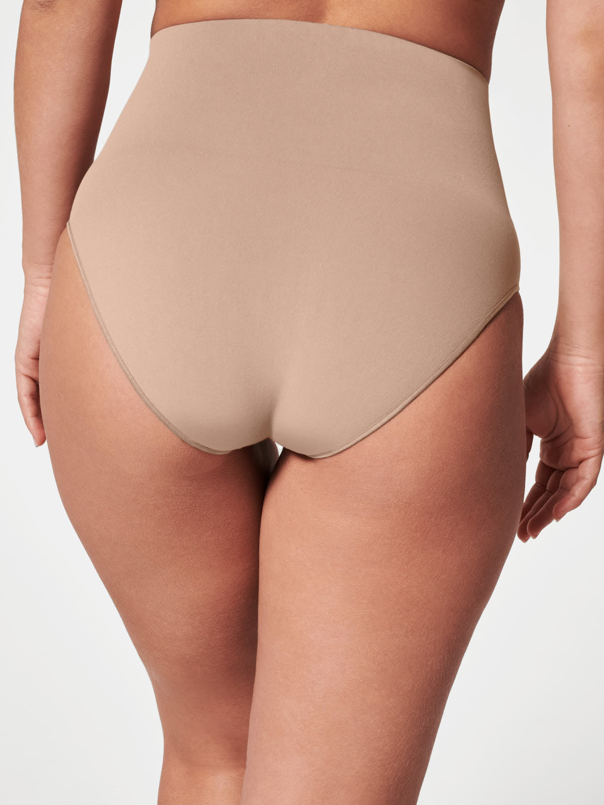 Back view of Spanx SPANX EcoCare Seamless Brief in oatmeal color on model against white background