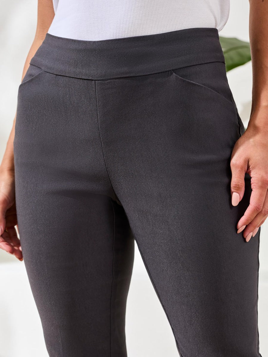 Close-up of black Tribal Performance Stretch Flatten 28” Pants by Tribal Sportswear Inc. showing fabric texture and fit details