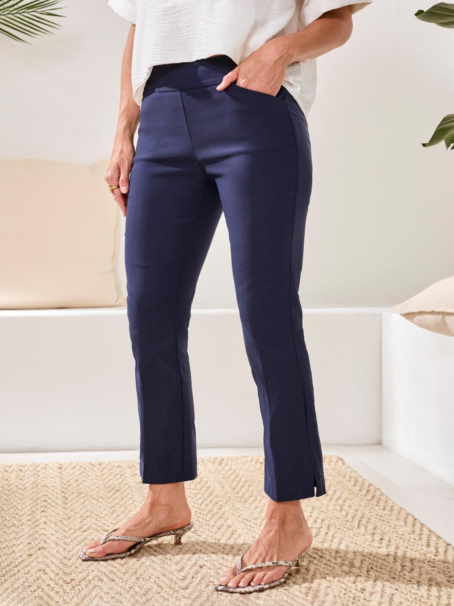 Tribal Performance Stretch Flatten 28” Pants in navy blue by Tribal Sportswear Inc., featuring a slim fit and ankle slits.