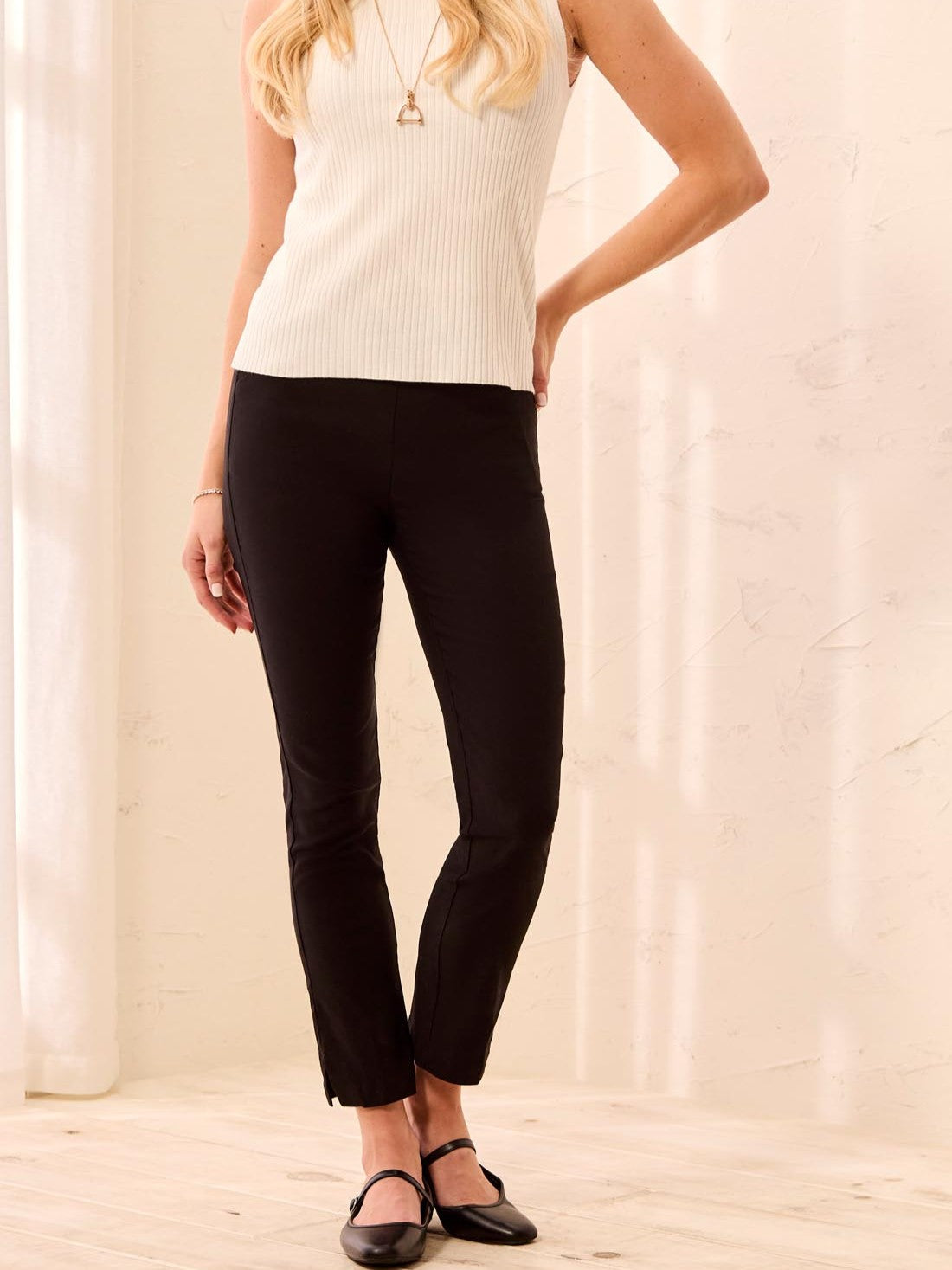 Tribal Petite Flatten It Pull-On Pant in black by Tribal Sportswear Inc., slim fit with ankle slits and sleek design