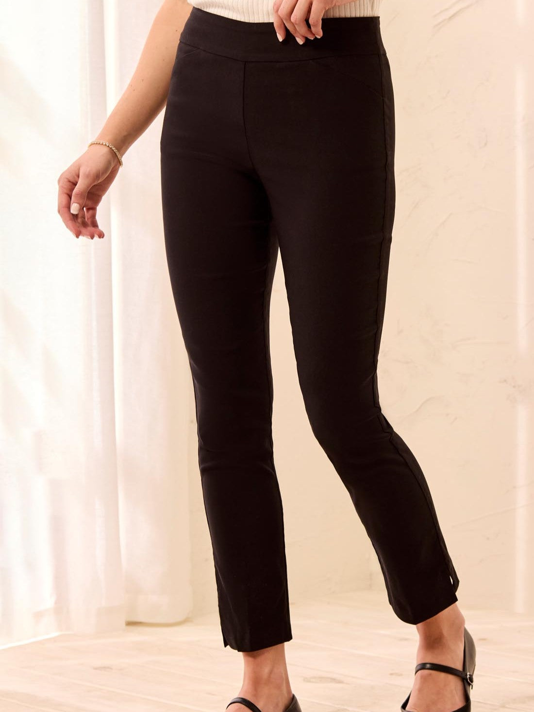 Black Tribal Petite Flatten It Pull-On Pant from Tribal Sportswear Inc. with a slim, ankle-length fit.