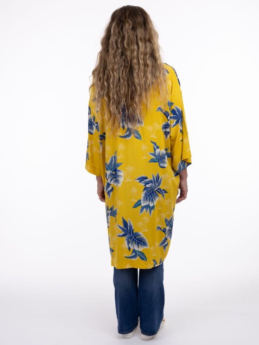 Back view of a yellow floral kimono over denim pants, Shannon Passero Janis OS Palm Denim Long Kimono by SHANNON PASSERO INC
