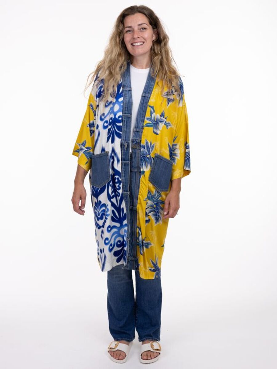 Model in SHANNON PASSERO INC Shannon Passero Janis OS Palm Denim Long Kimono with blue and yellow floral denim outerwear