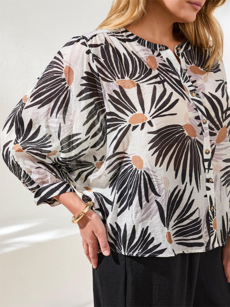 Tribal Late Bloom Muted Floral Dolman Sleeve Top from Tribal Sportswear Inc. in soft muted floral print and button front