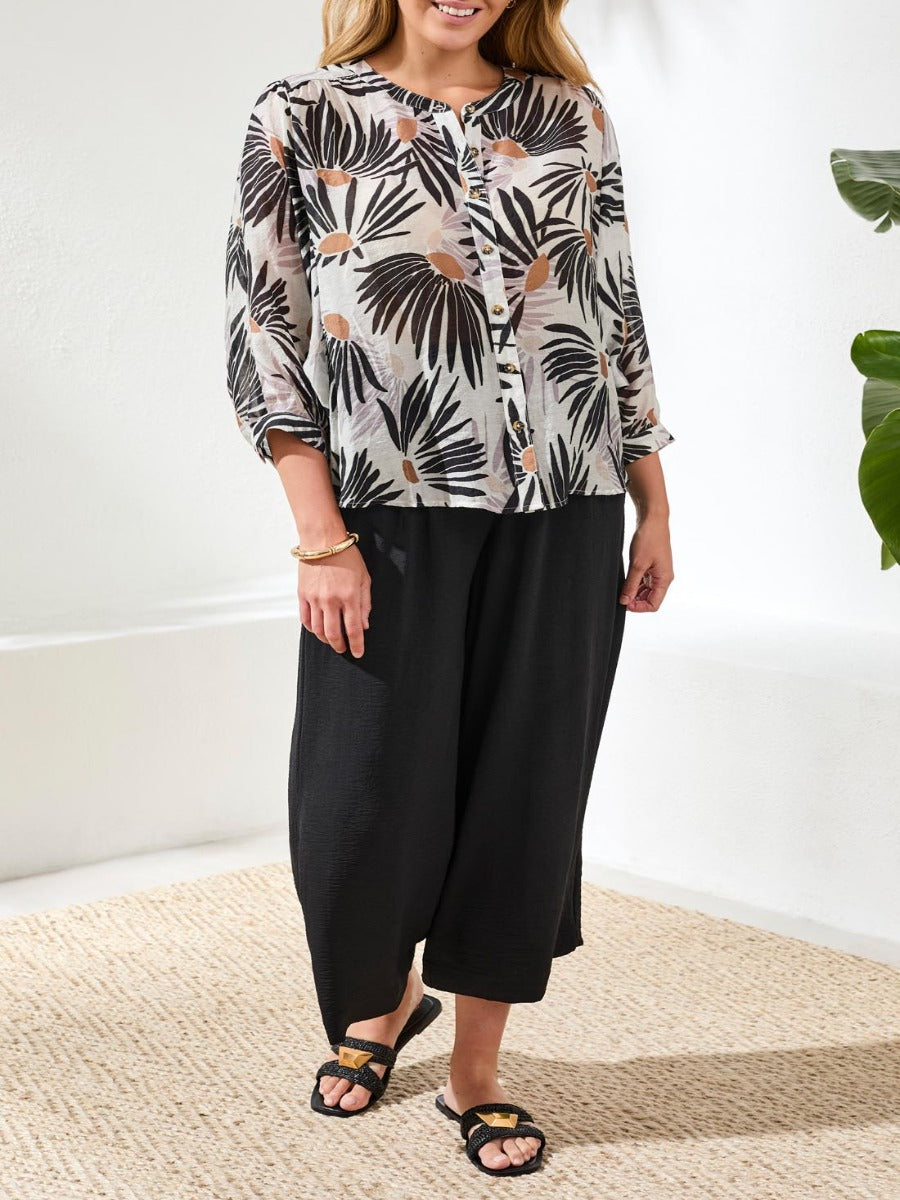 Tribal Late Bloom Muted Floral Dolman Sleeve Top by Tribal Sportswear Inc., soft floral top and black wide pants.