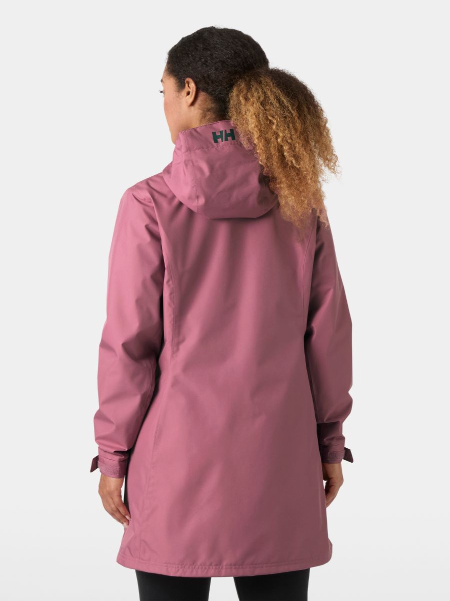 Person wearing a pink jacket with a visible brand logo on a white background