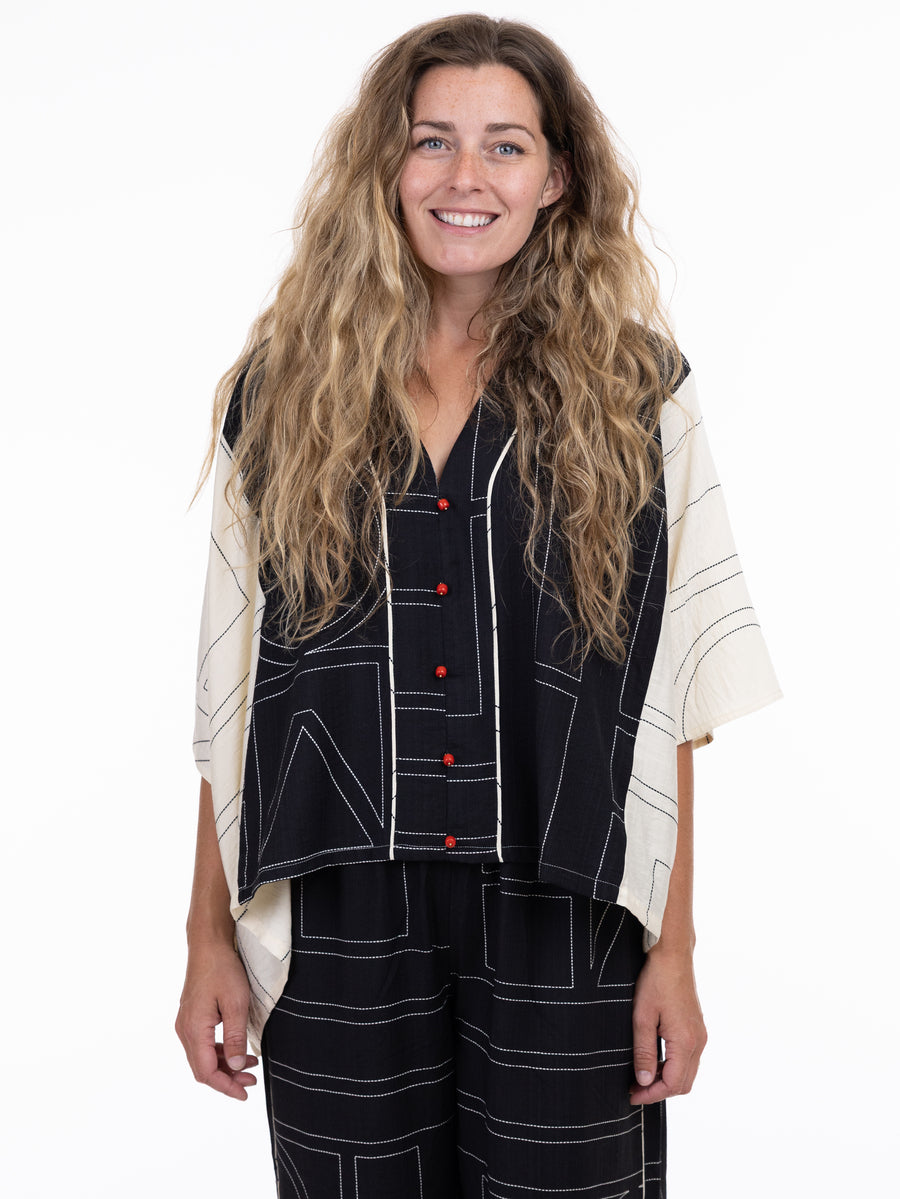Shannon Passero Emmie Deco Mix Top from SHANNON PASSERO INC in black and cream with geometric patterns and red buttons