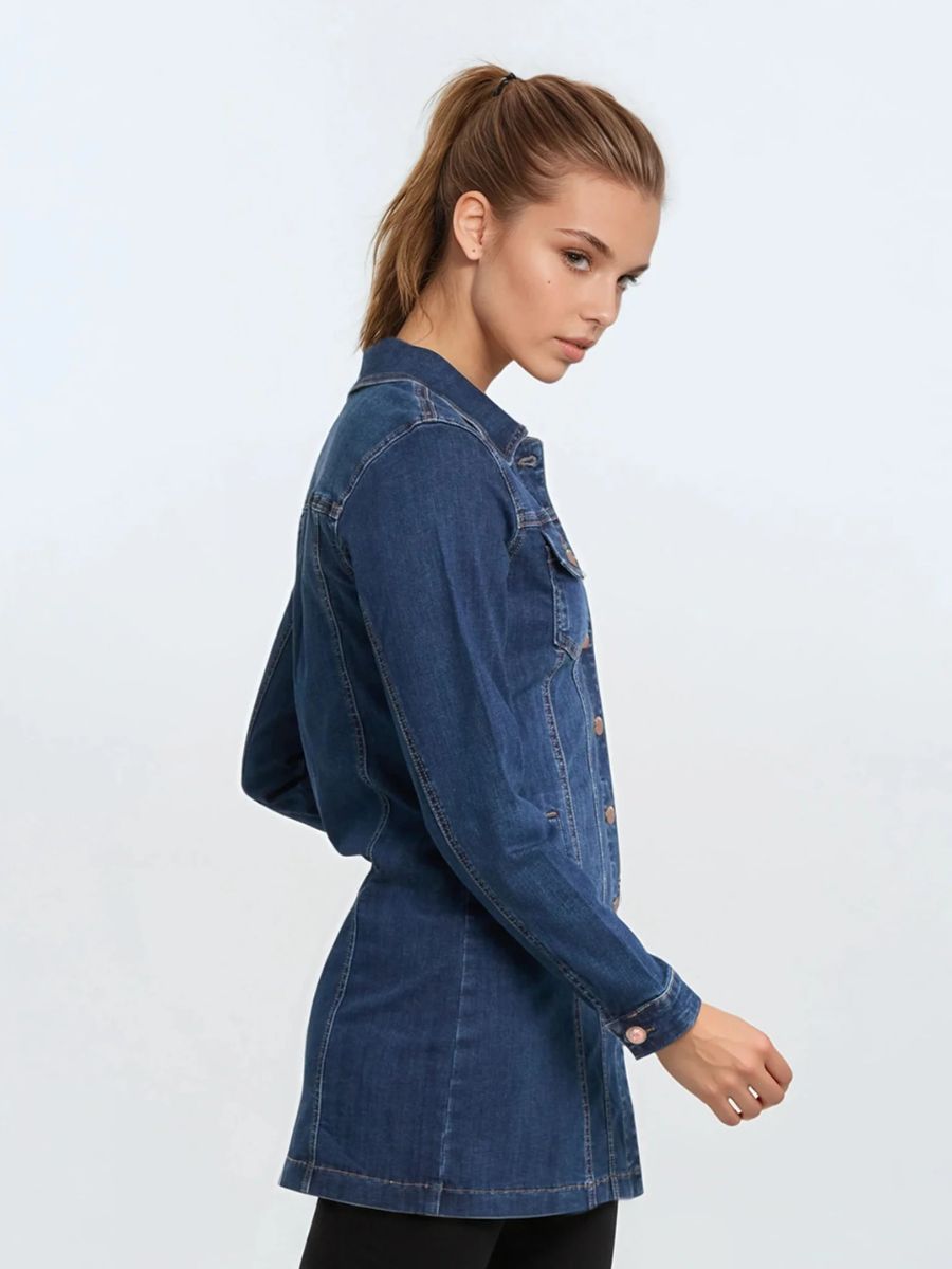 Side view of a fitted dark blue denim jacket with copper buttons against a plain light background