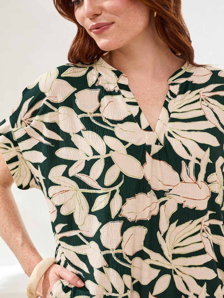 Close-up of green and cream floral fabric of Tribal Lush Oasis Pocket Dress by Tribal Sportswear Inc.