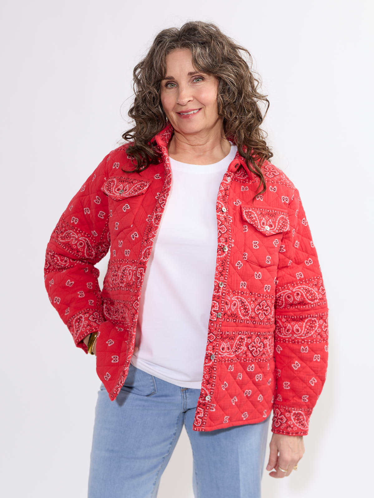Red bandana patterned quilted jacket styled with casual white top and light blue jeans by SHANNON PASSERO INC, Shannon Passero Bandana Quilted Shacket