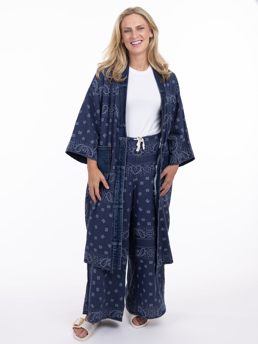Smiling person wearing Shannon Passero Bandana OS Long Kimono in navy with bandana print by SHANNON PASSERO INC