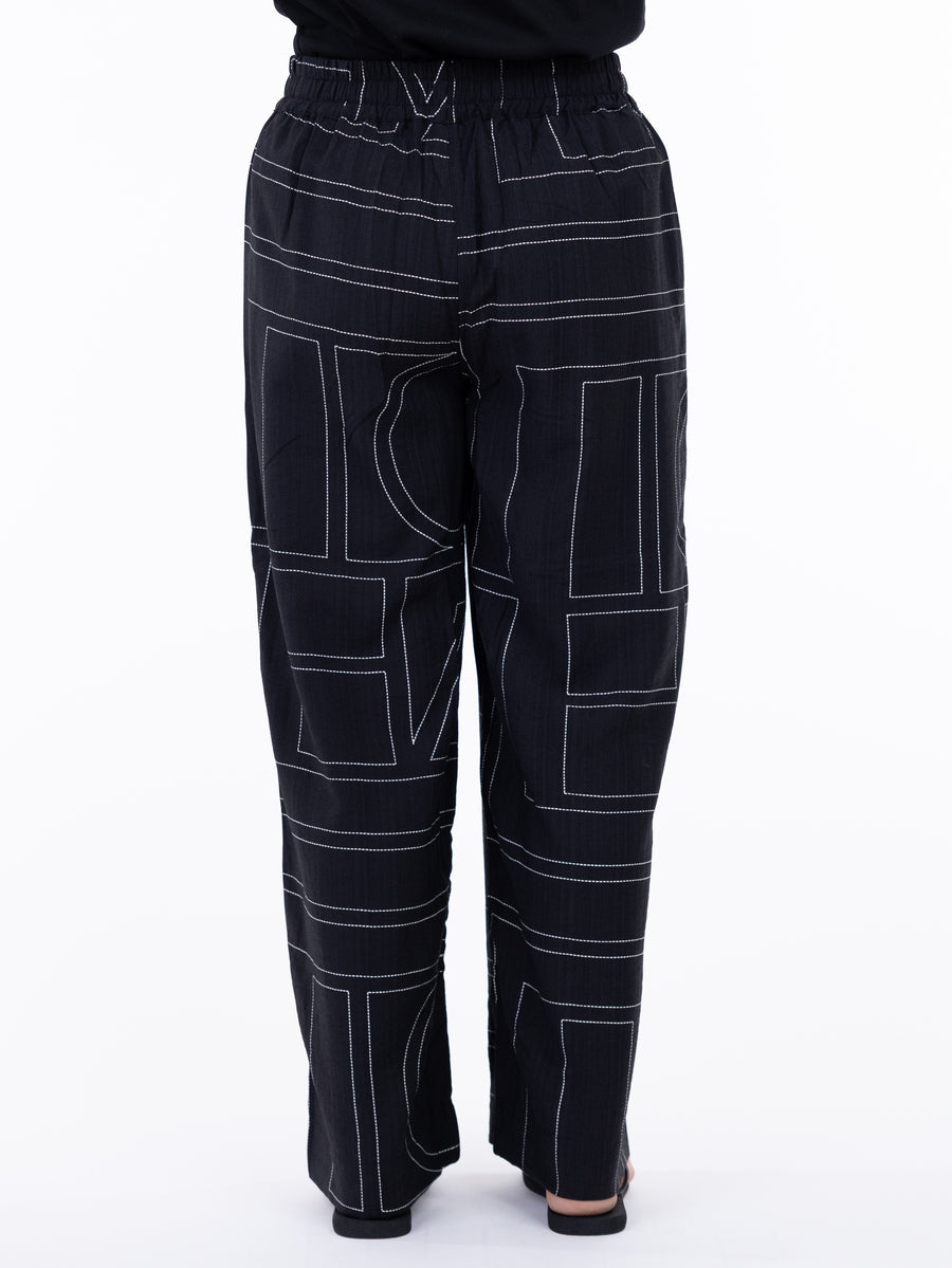 Back view of black geometric pattern pants with elastic waist, Shannon Passero Lani Art Deco Pant by SHANNON PASSERO INC