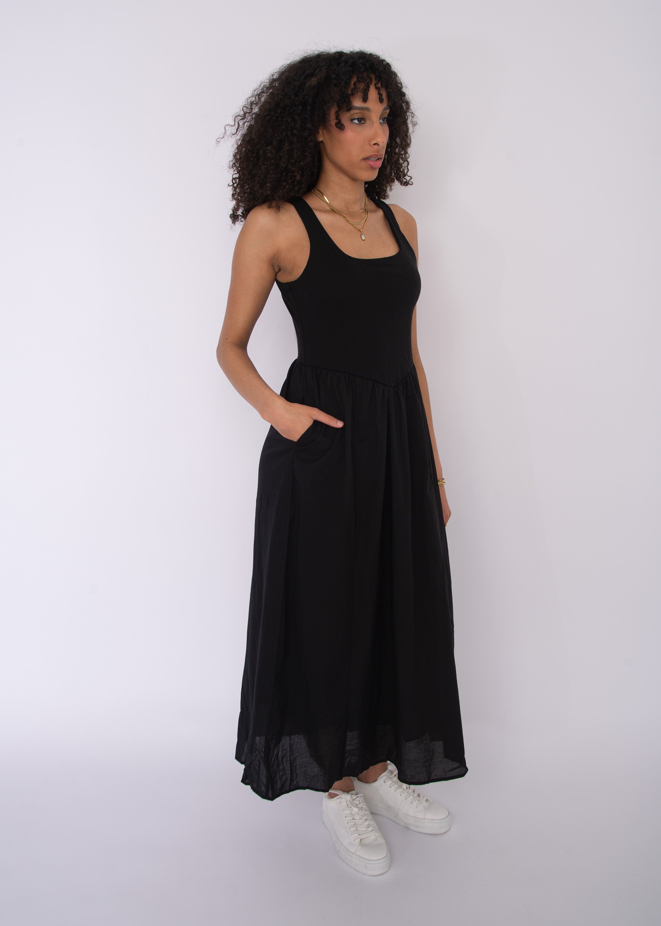 Voila Combo Sleeveless Maxi Dress in black by Class Couture, featuring a fitted bodice and flowing skirt with pockets.