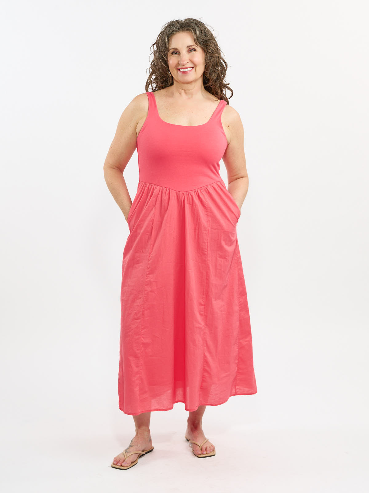 Voila Combo Sleeveless Maxi Dress in coral with pockets, designed by Class Couture, displayed on neutral background.