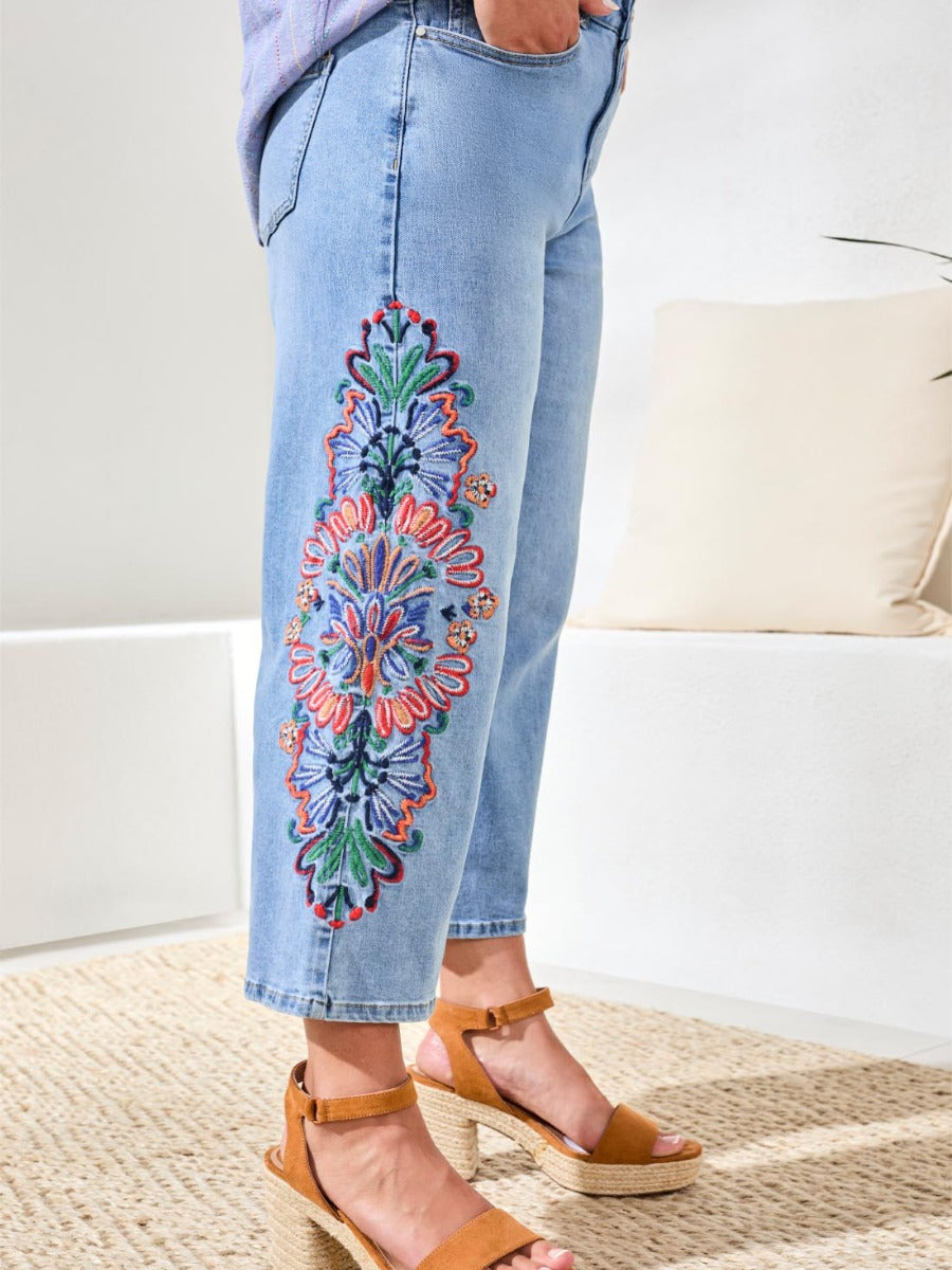 Light blue Tribal Ray of Colour Audrey Embroidered 25" Denim with colorful floral embroidery by Tribal Sportswear Inc.