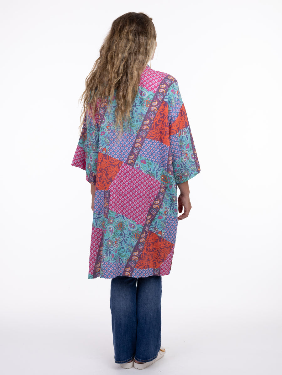Back view of colorful Shannon Passero Island Kimono with floral and geometric patterns by SHANNON PASSERO INC