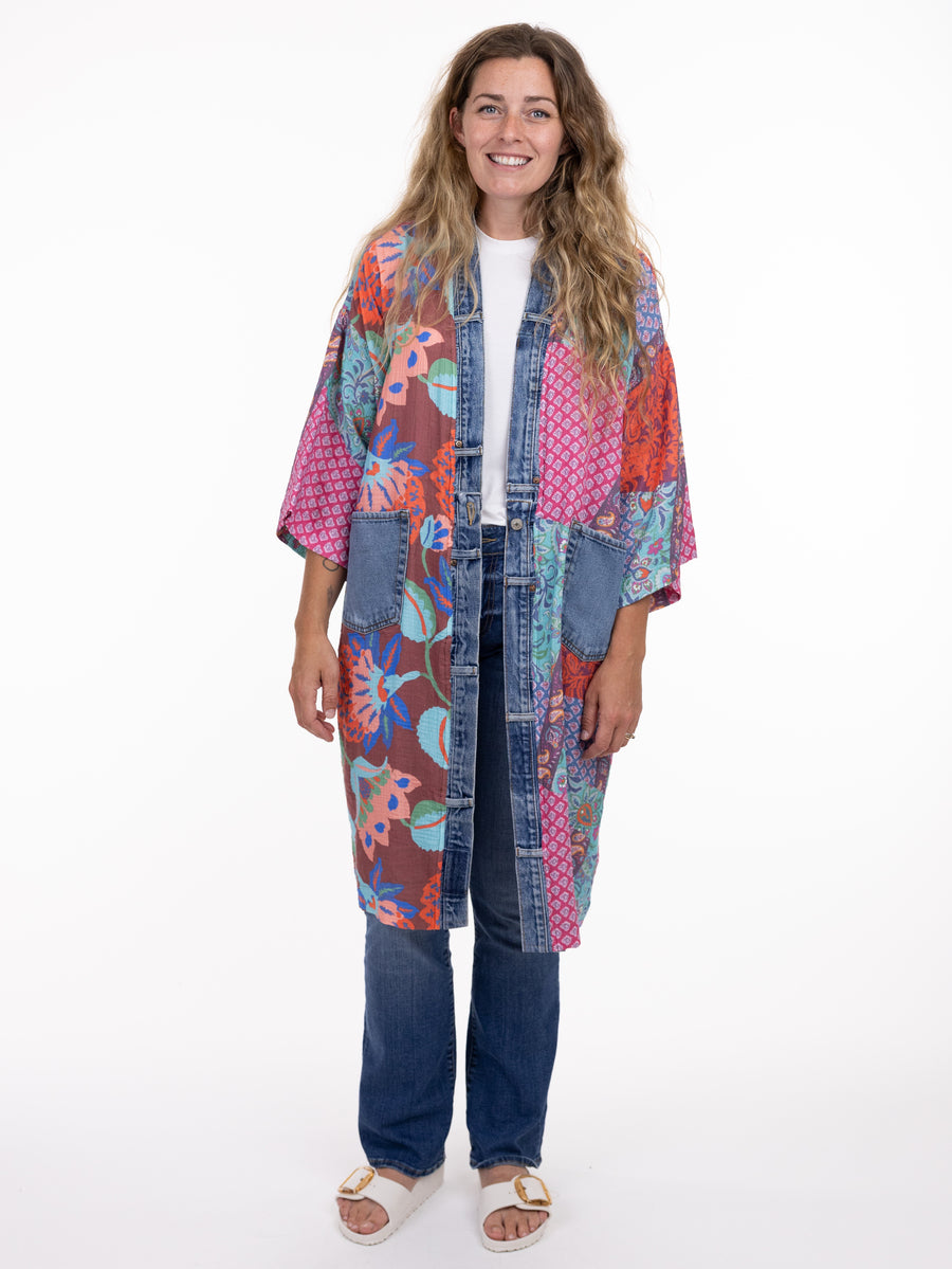 Colorful patchwork Shannon Passero Island Kimono with denim trim and pockets by SHANNON PASSERO INC, styled over casual jeans and top