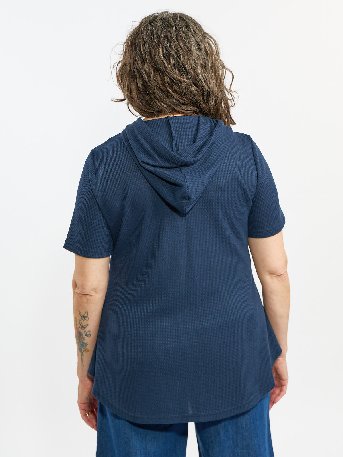 Back view of a navy Hooded Waffle Short Sleeve Casual Top by Nulook Fashions with textured fabric and relaxed fit.