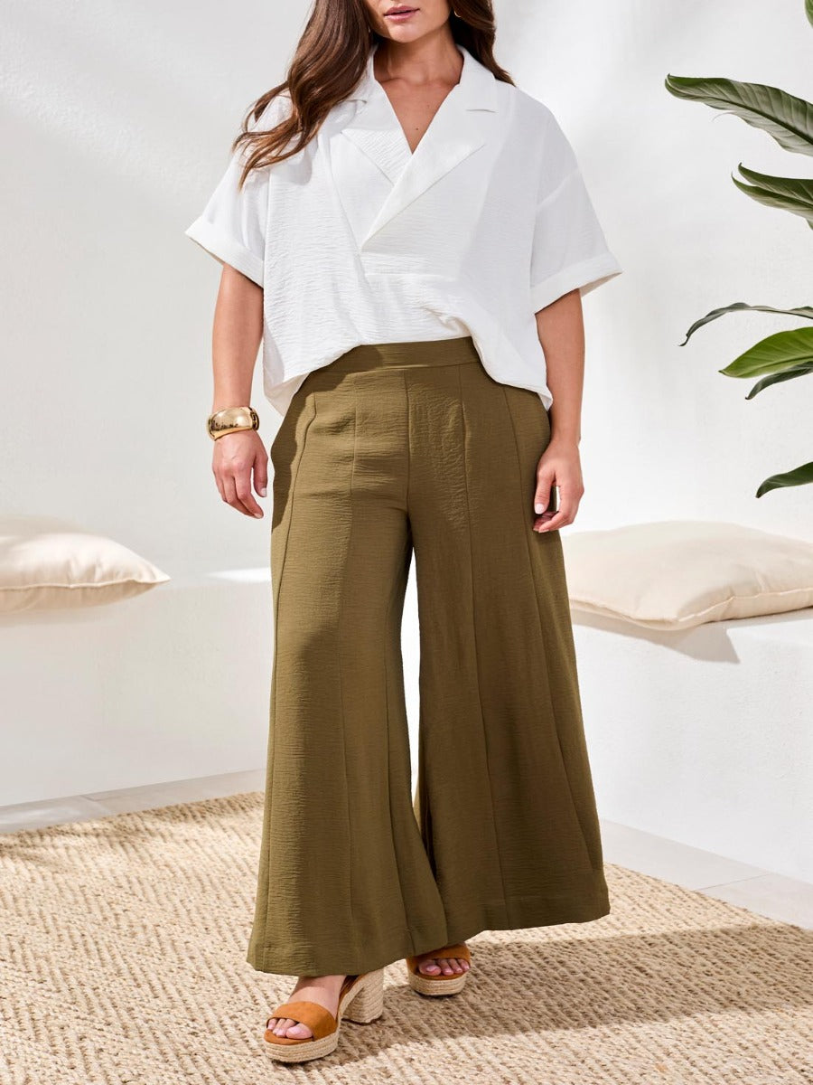 Olive wide-leg pants styled with a loose white top and platform sandals from Tribal Sportswear Inc., Tribal Lush Oasis Airflow Wide-Leg Pants