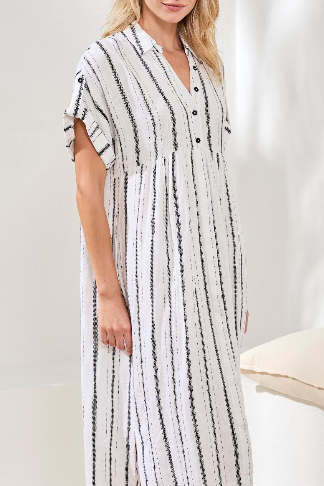 Tribal Prep & Petals Linen Stripe Dress by Tribal Sportswear Inc. features white linen with black vertical stripes and button details.