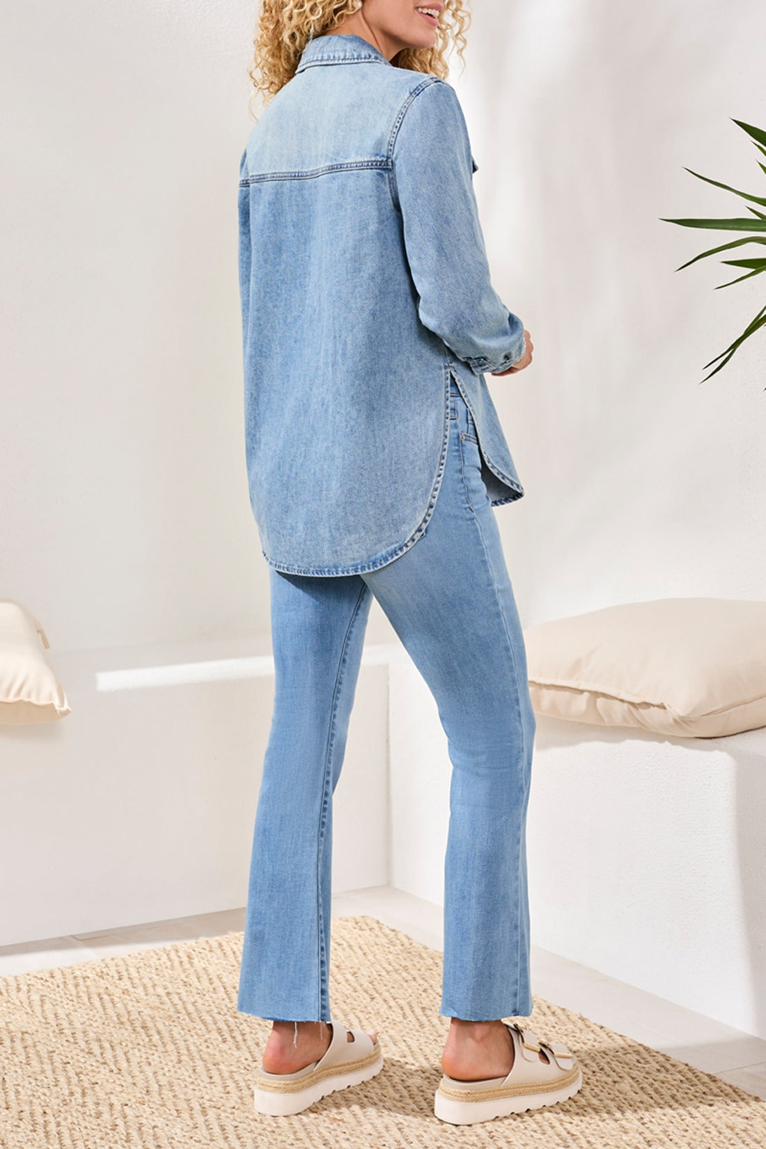 Light wash denim jacket styled casually with jeans and sandals, featuring Tribal Lush Oasis Long Sleeve Denim Shirt by Tribal Sportswear Inc.