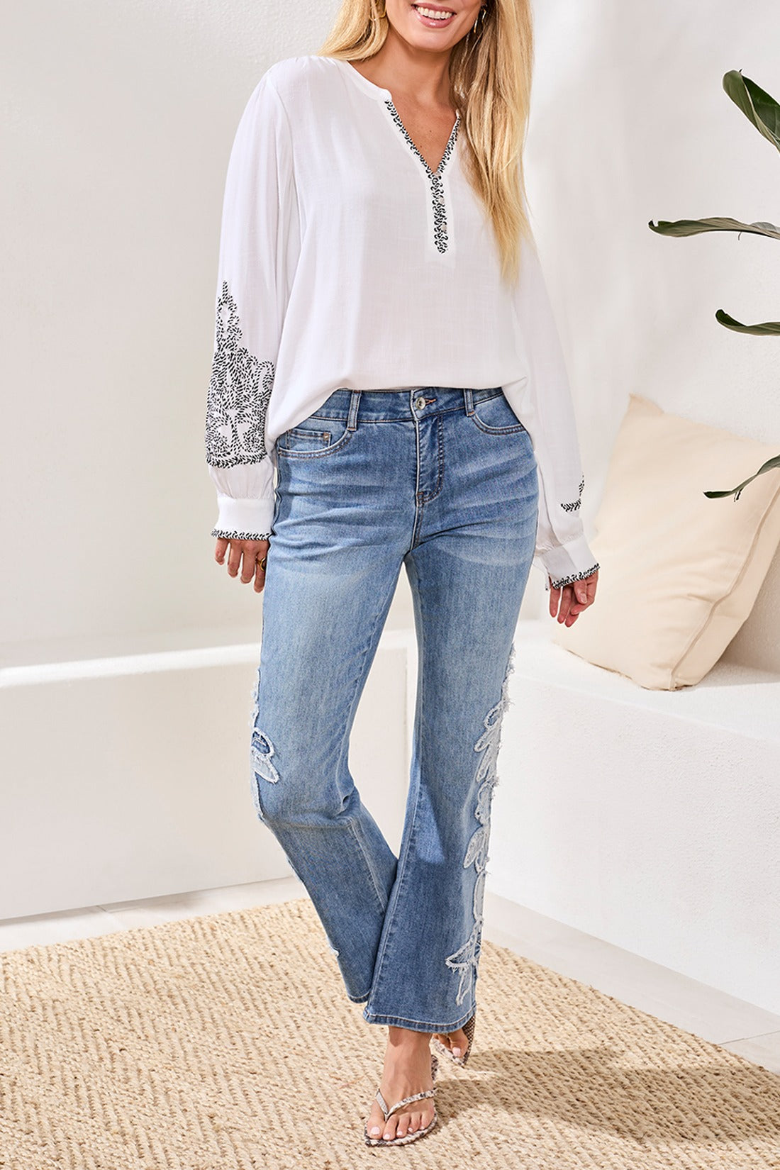 Tribal Lush Oasis Sophia Floral 31" Jeans by Tribal Sportswear Inc. in light denim with floral embroidery detail.