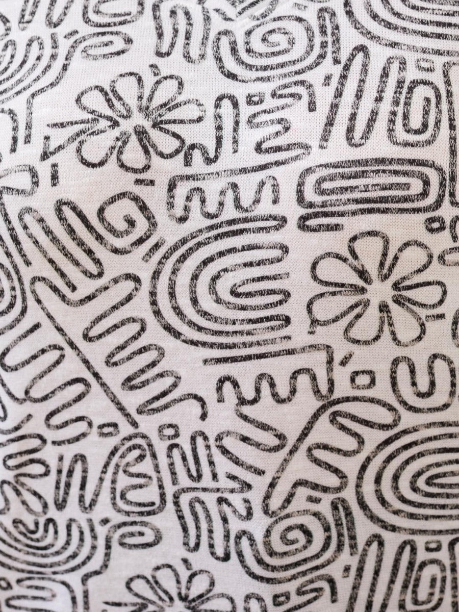 Close-up of abstract black and white print on Tribal Wear-Me-Two-Ways Printed Short Sleeve Top by Tribal Sportswear Inc.