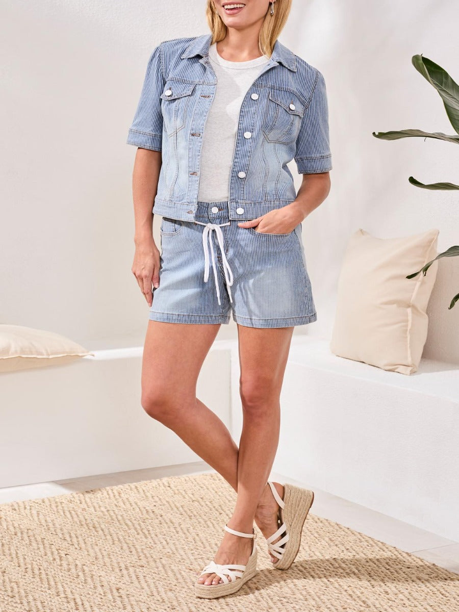 Tribal Ray of Color Railroad Stripe 5" Denim Shorts by Tribal Sportswear Inc. styled with light denim jacket and sandals