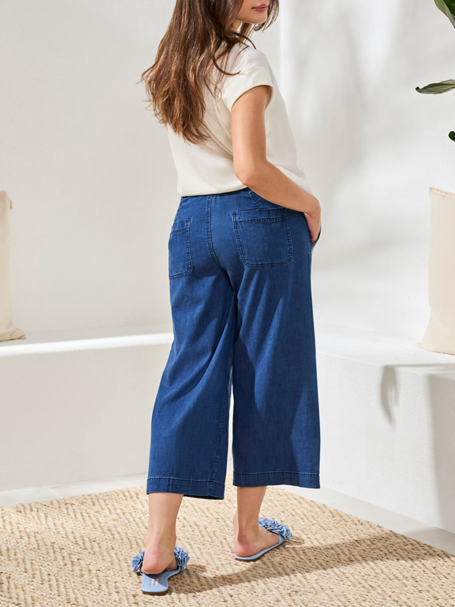 Denim version of Tribal Audrey Tie-Waist 25" Wide-Leg Pants by Tribal Sportswear Inc. in a casual setting.