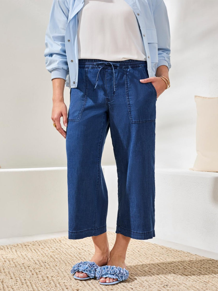 Tribal Audrey Tie-Waist 25" Wide-Leg Pants in dark denim by Tribal Sportswear Inc. styled with light jacket and sandals