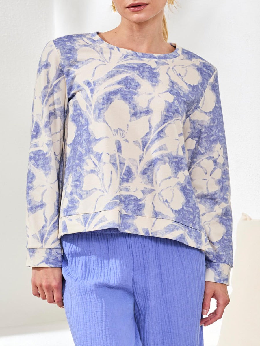Tribal Lush Oasis Printed Side-Slit Top by Tribal Sportswear Inc. in soft blue floral print, paired with textured blue pants