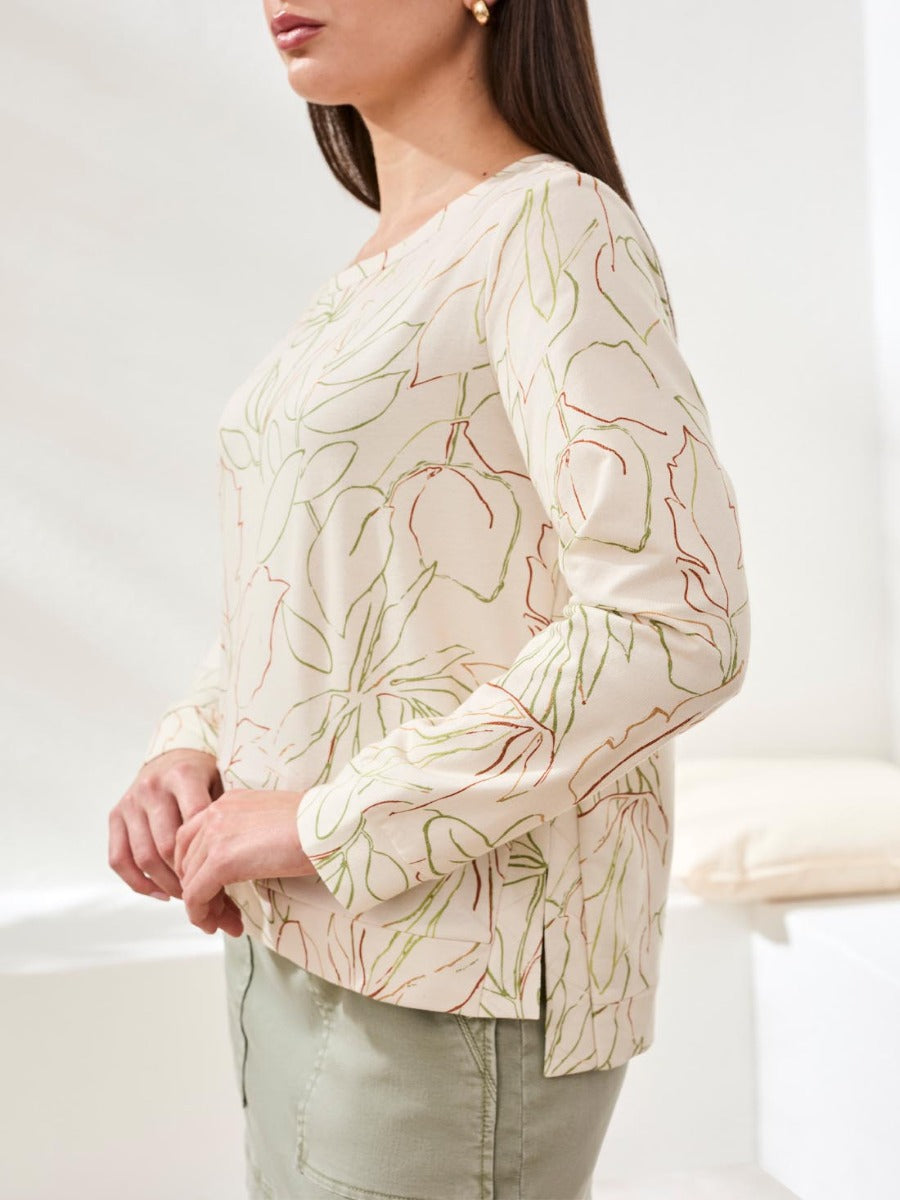 Tribal Lush Oasis Printed Side-Slit Top by Tribal Sportswear Inc. in light floral print with side slit detail.