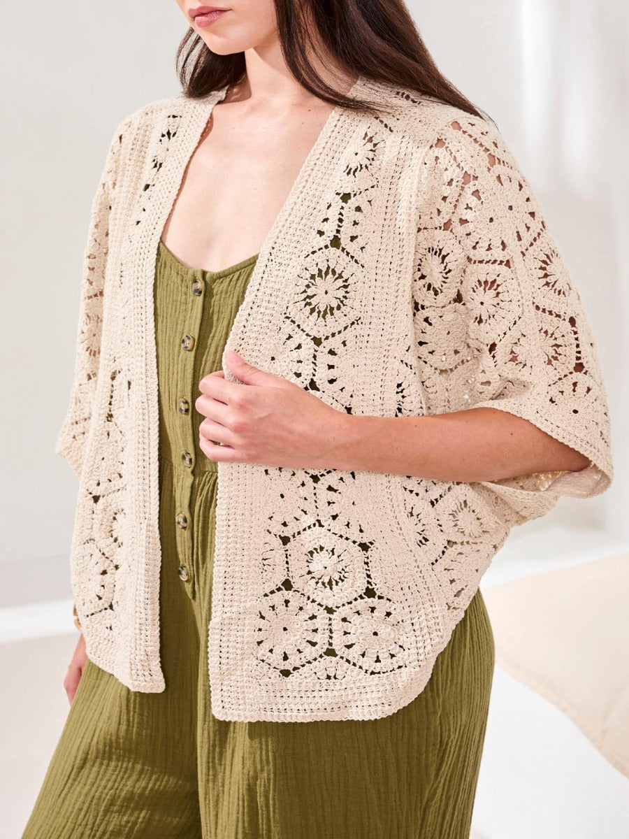 Light beige Tribal Lush Oasis Crochet Open Cardigan by Tribal Sportswear Inc. with intricate openwork sweater detailing.