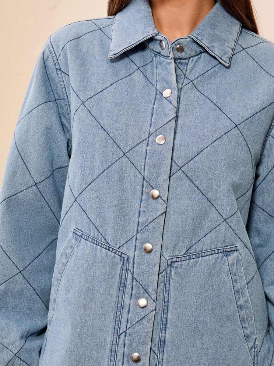 Light blue denim jacket with diamond-quilted pattern, snap button closure, and front patch pockets.