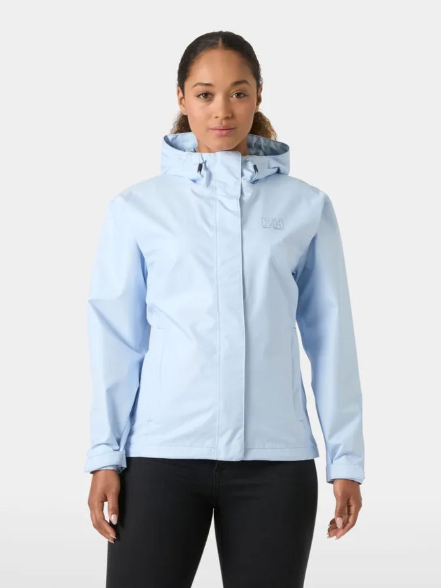 Woman wearing a light blue jacket on a white background