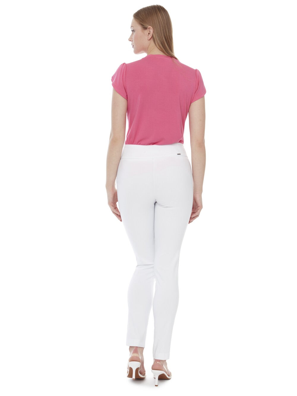 Back view of white UP 31" Basic Control Warp Slim Pant by Up styled with pink short sleeve top and white heels.