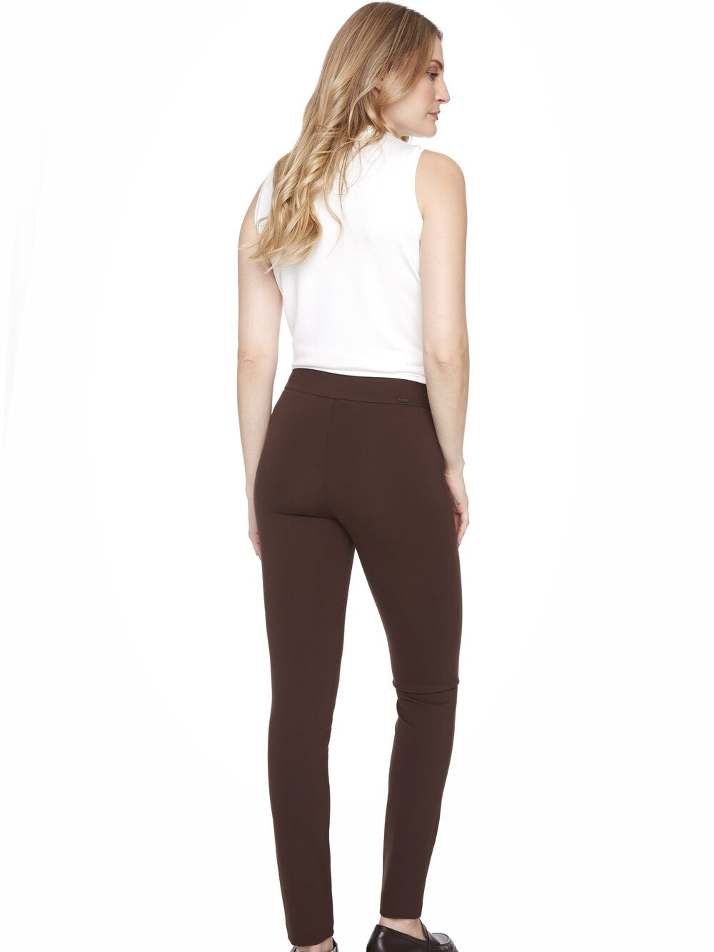 Slim fit brown UP Ponte Basic Slim Pant 31" by Up shown from the back with white sleeveless top and black shoes