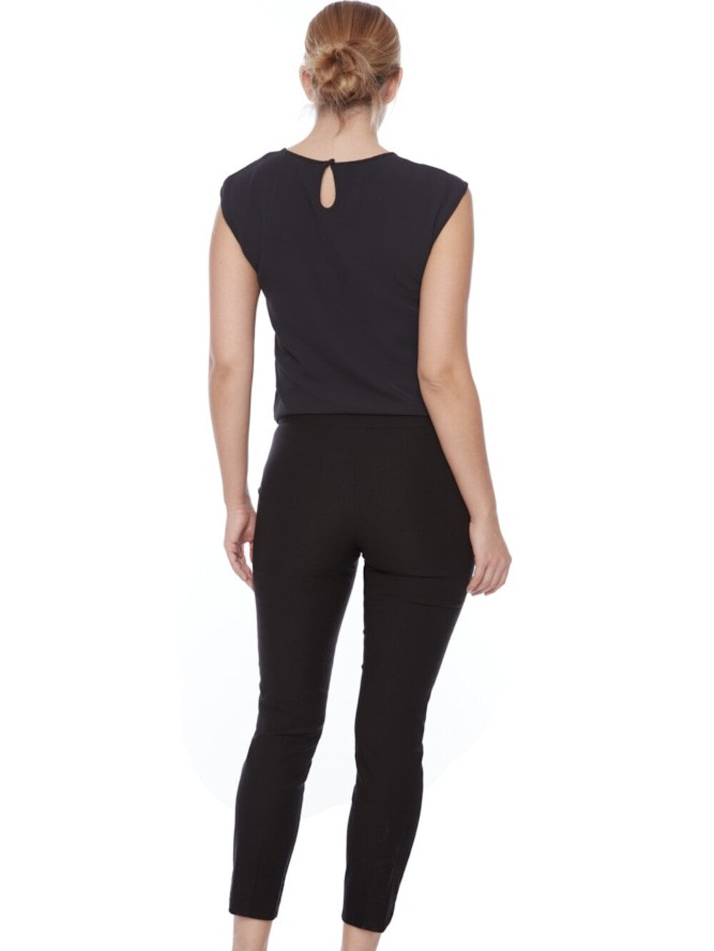 Black UP Solid Wrap 28" Petal Slim Pant by Up, styled with a sleeveless black top, back view.
